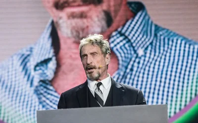 John McAfee ‘Comes Back To Life’ To Promote Memecoin On X, With Users Claiming Account Was Hacked Despite Widow’s Message