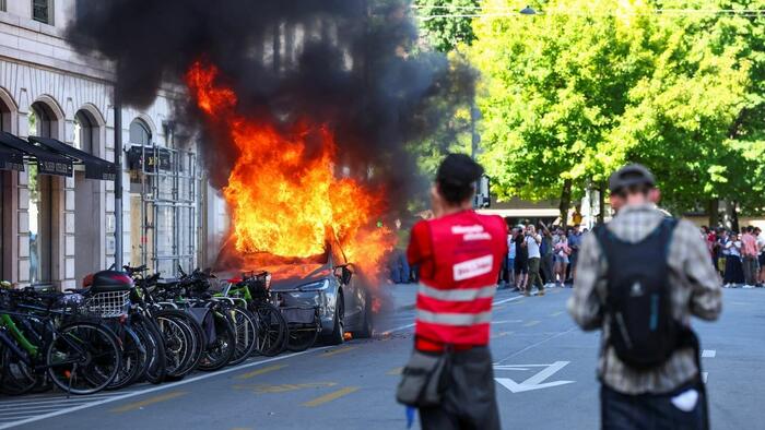 G7 Protesters Smash Windows, Set Tesla On Fire In Geneva