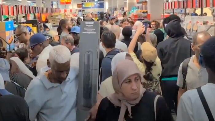 Multicultural French Crowds Brawl Over Discount Air Conditioners As Heatwave Looms